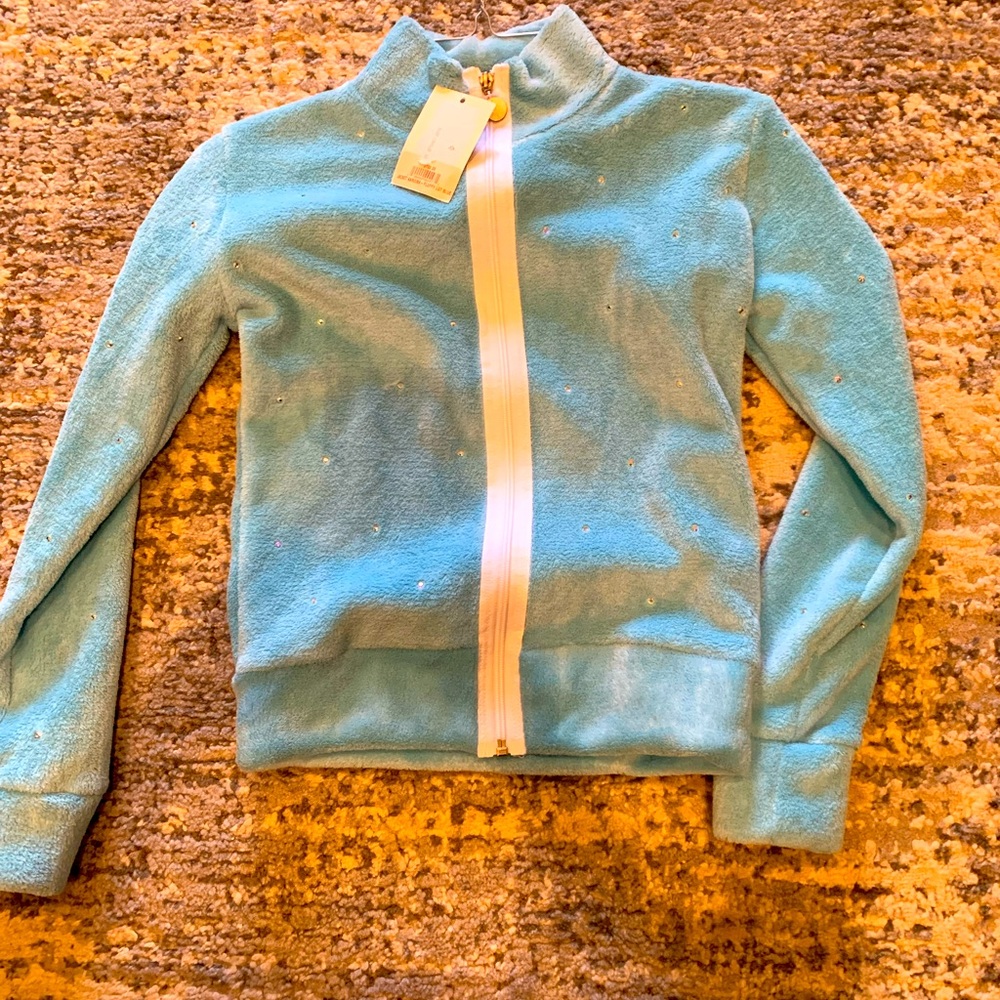 Karisma fluffy blue jacket with rhinestones.